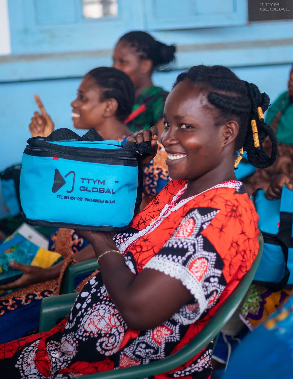 Woman smiling with TTYM kit bag