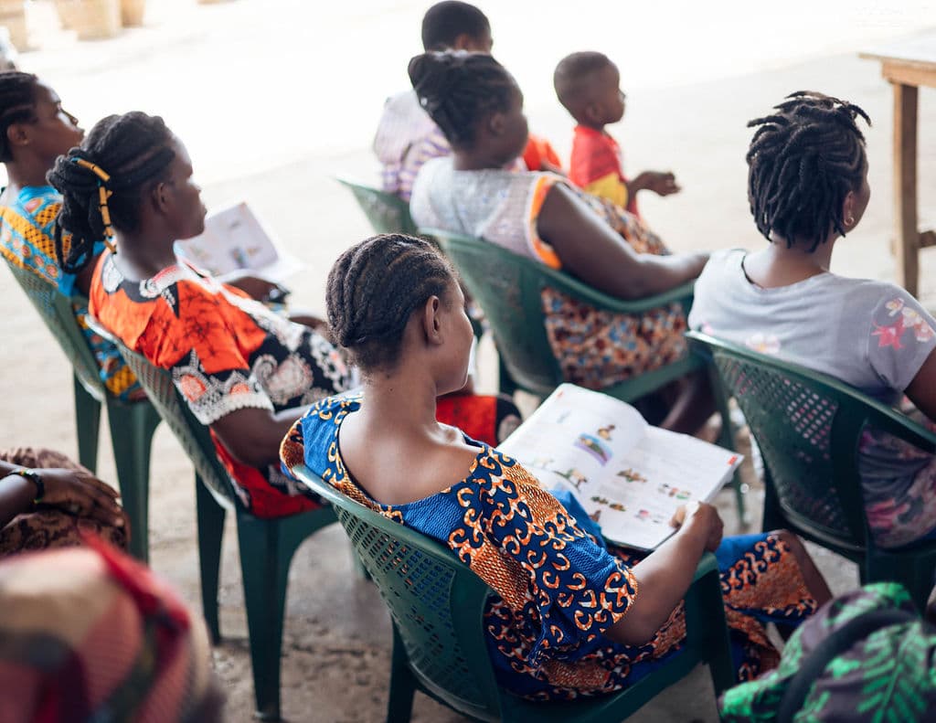 Market women learning about reproductive health services