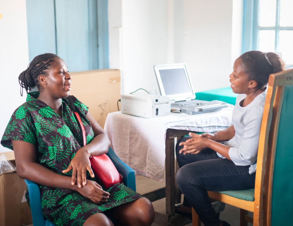 sarah talking with patient