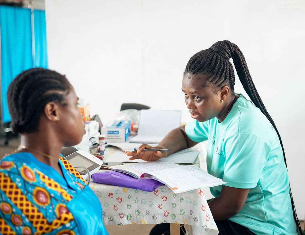 worker talking with patient during consultation